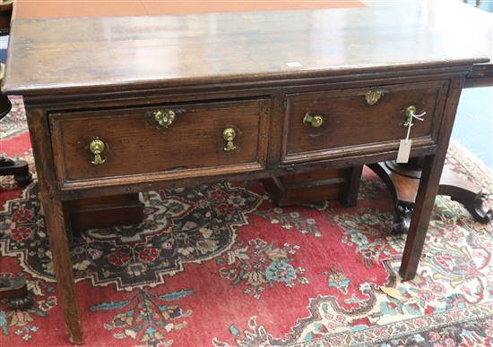 An 18th century oak dresser base, fitted two moulded drawers, on square legs, W.122cm